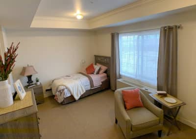 Bedroom with bed and chair