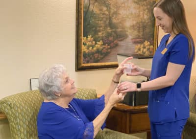 Nurse giving a woman pills for care services